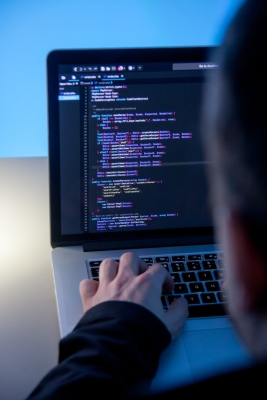 programmer working on laptop