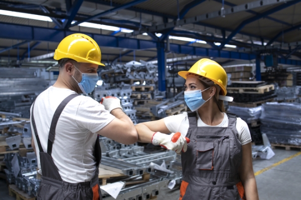 people-working-factory-touching-with-elbows-greeting-due-corona-virus-infection