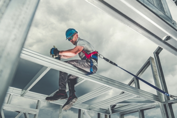 man welding on structure
